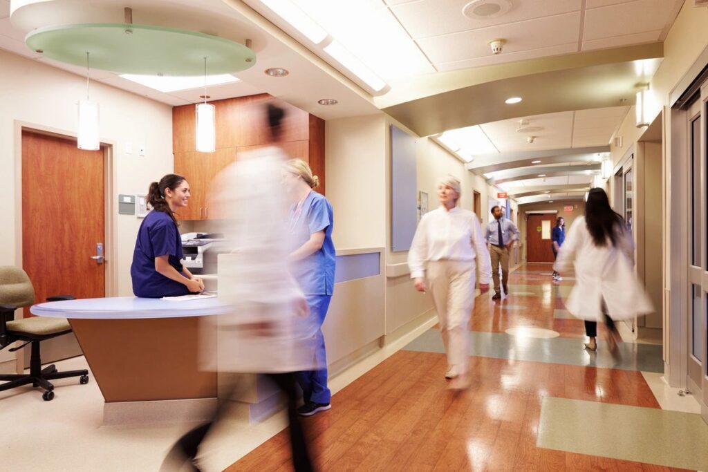 A group of doctors and nurses in the hallway.