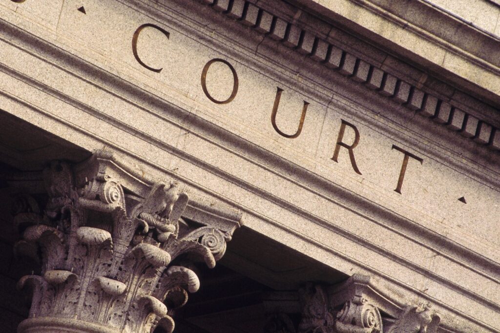 A close up of the front entrance to a court house.